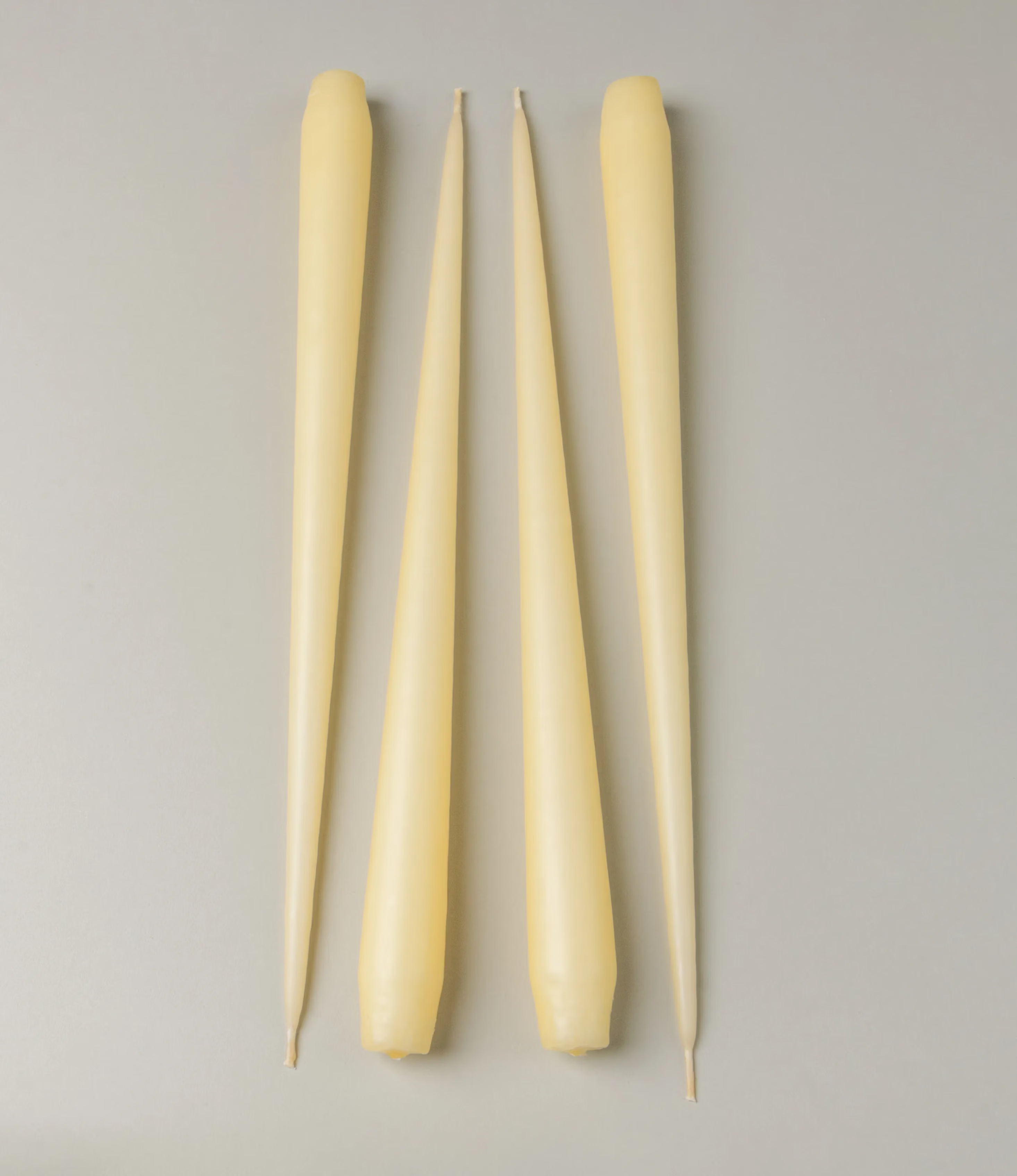 Ester&Erik Taper Candle coming in a buttermilk shade. The package contains 4 taper candles of the same shade.