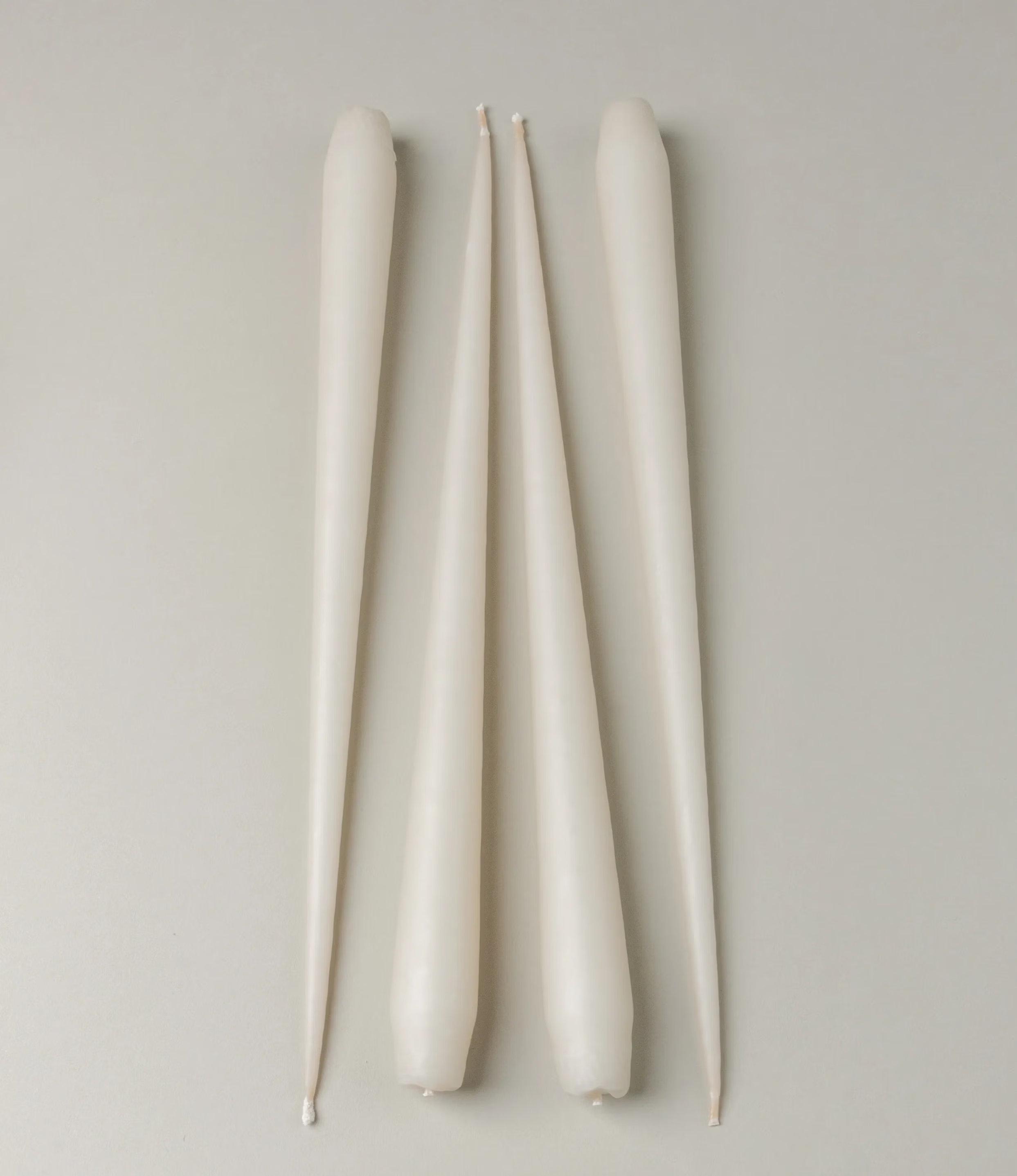 Ester&Erik Taper Candle coming in an ivory shade. The package contains 4 taper candles of the same shade.