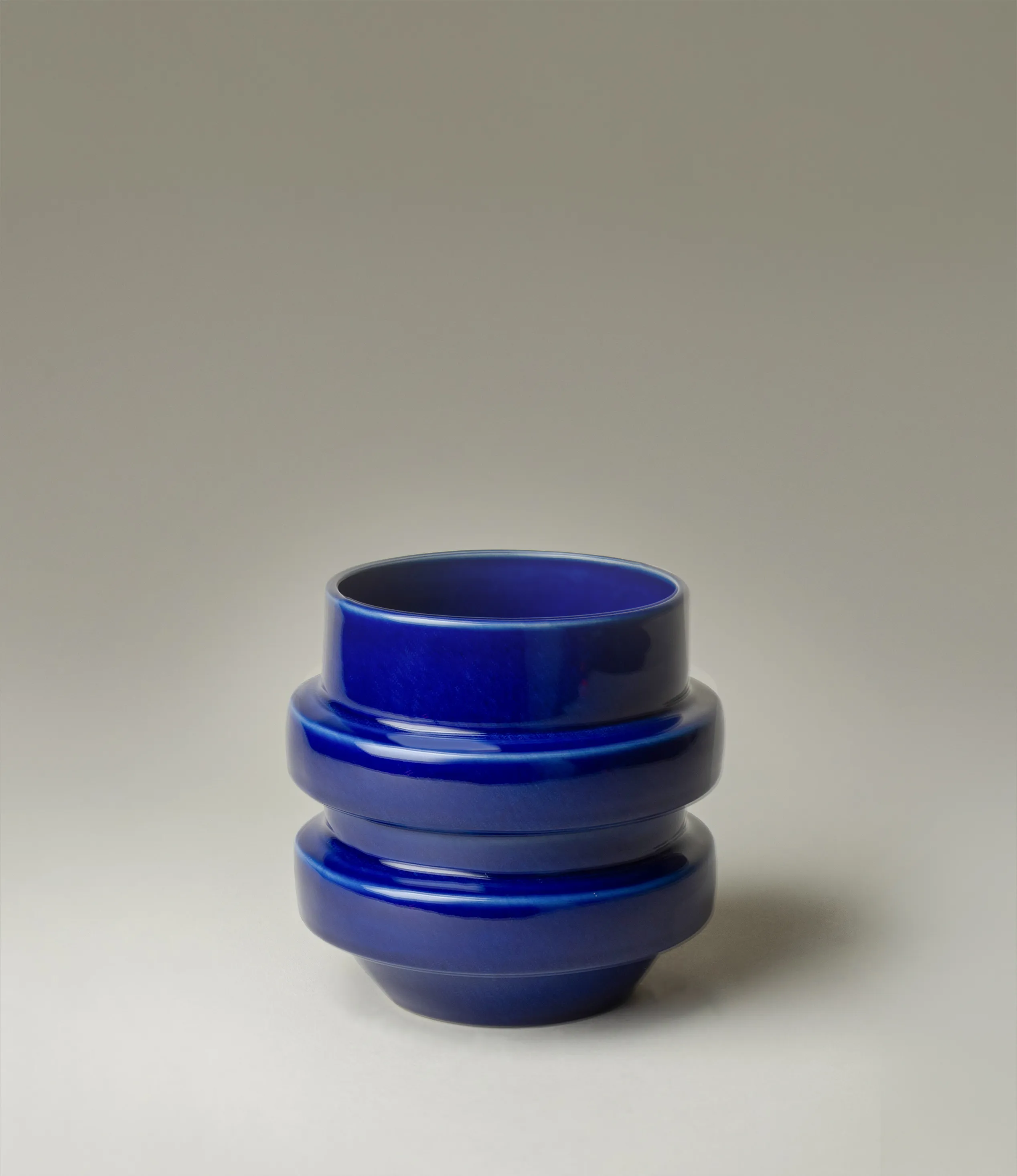 NW Buoy was designed by Nova Casa Atlantica. The planter has a dark blue color with a glossy glaze. 